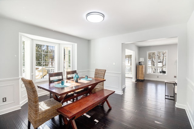 dining space featuring dark hardwood / wood-style floors