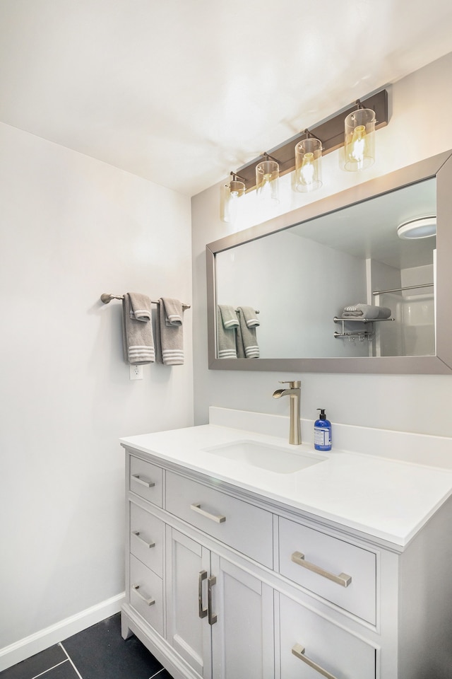 bathroom with tile patterned floors and vanity