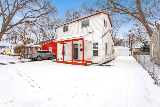 view of front property with an outdoor structure and a garage