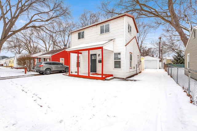 front of property featuring a garage and an outdoor structure