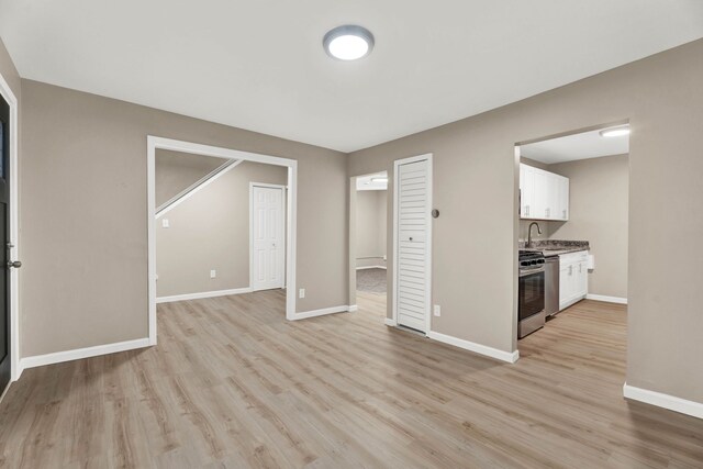 unfurnished living room with light hardwood / wood-style floors