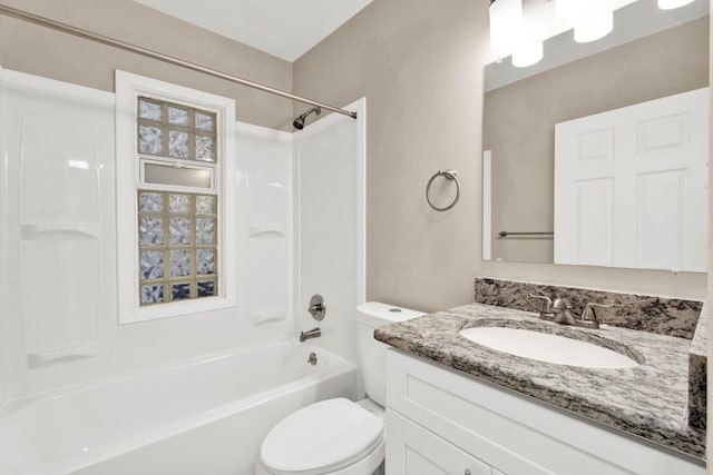 full bathroom featuring toilet, vanity, and bathtub / shower combination