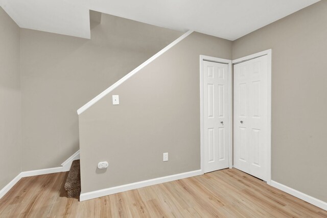 additional living space with wood-type flooring