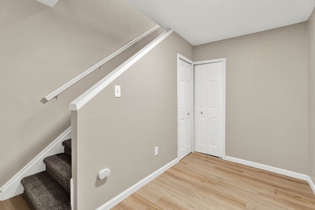 stairway featuring hardwood / wood-style floors