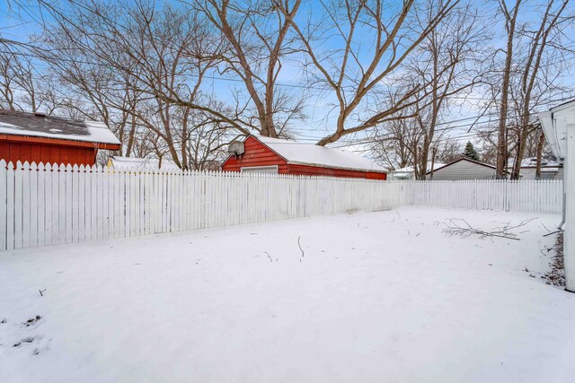 view of yard layered in snow