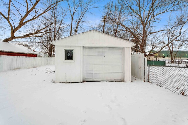 view of snow covered garage