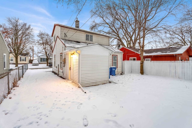 view of snow covered house