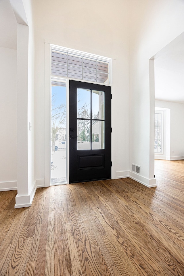 foyer with light hardwood / wood-style floors