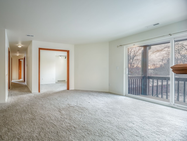 unfurnished room with light colored carpet