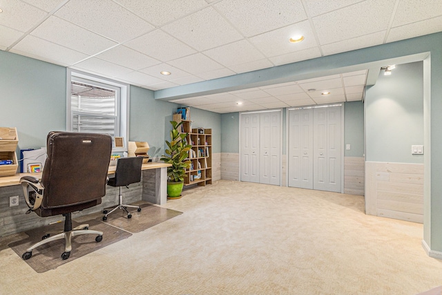 office with carpet floors and a paneled ceiling