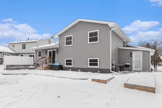 view of snow covered house