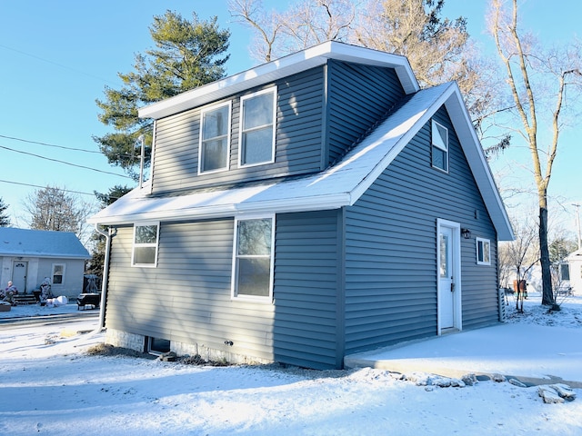 view of snow covered property