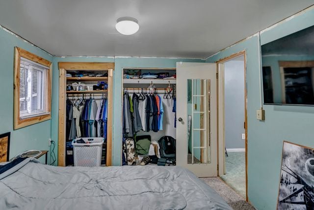 bedroom featuring light carpet