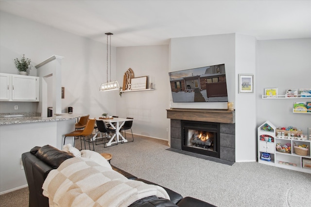 carpeted living room with vaulted ceiling