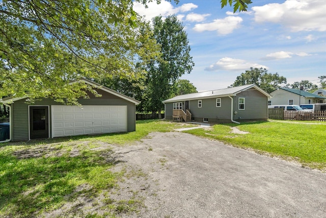 exterior space with an outdoor structure, a yard, and a garage