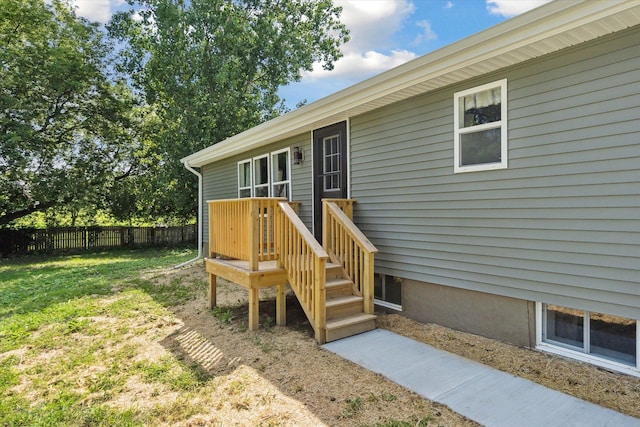 entrance to property with a yard