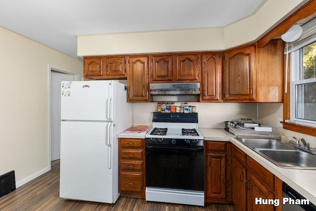 kitchen with range with gas stovetop, black dishwasher, dark hardwood / wood-style flooring, white fridge, and sink