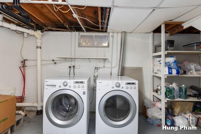 clothes washing area with washer and dryer