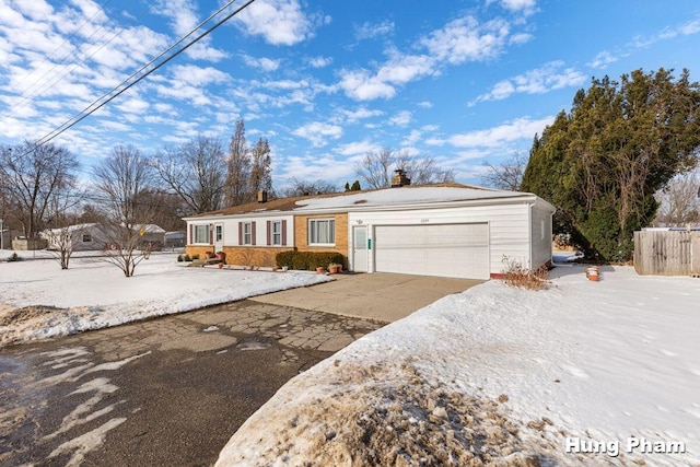 single story home featuring a garage