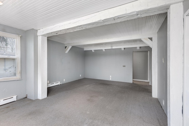 interior space featuring a baseboard heating unit, beamed ceiling, and carpet flooring