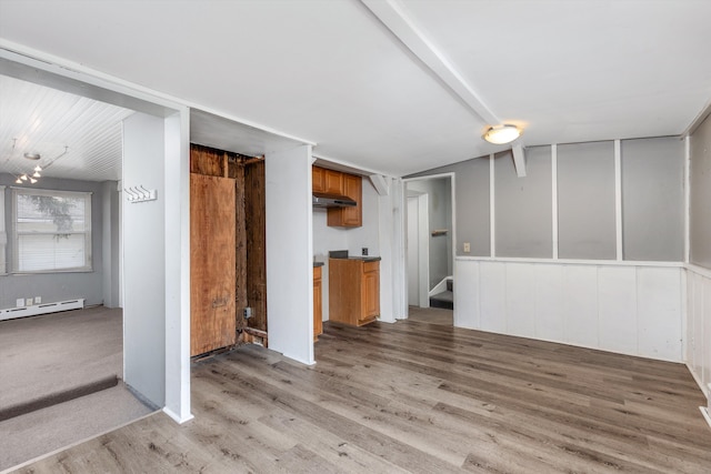 unfurnished living room with a baseboard radiator and light wood-type flooring