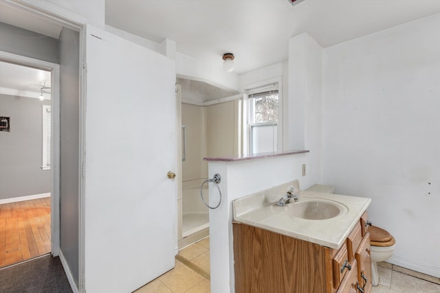 bathroom with vanity, tile patterned floors, and toilet