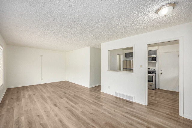 unfurnished living room with light wood-type flooring