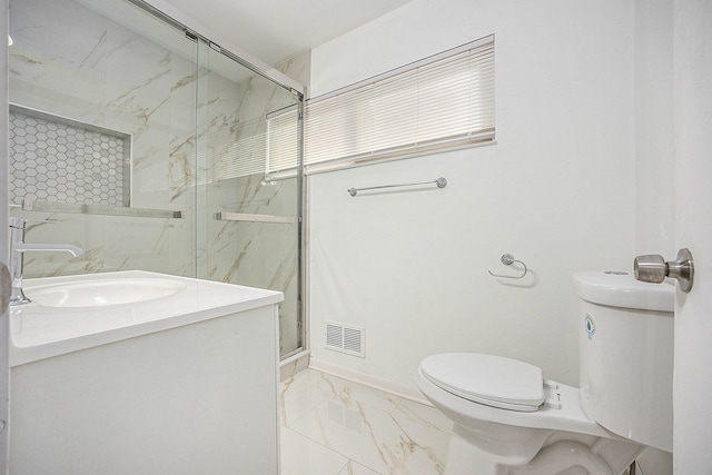 bathroom with toilet, a shower with door, and vanity