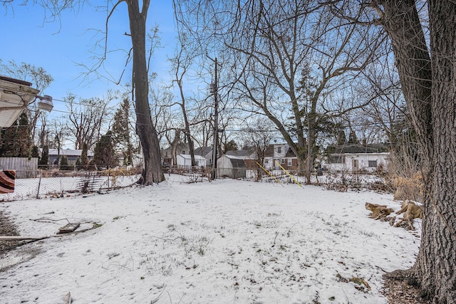 view of yard layered in snow