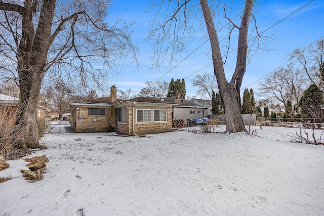 view of snow covered house