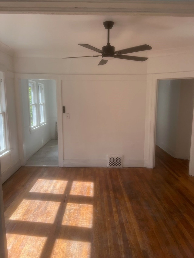 empty room featuring hardwood / wood-style floors and ceiling fan