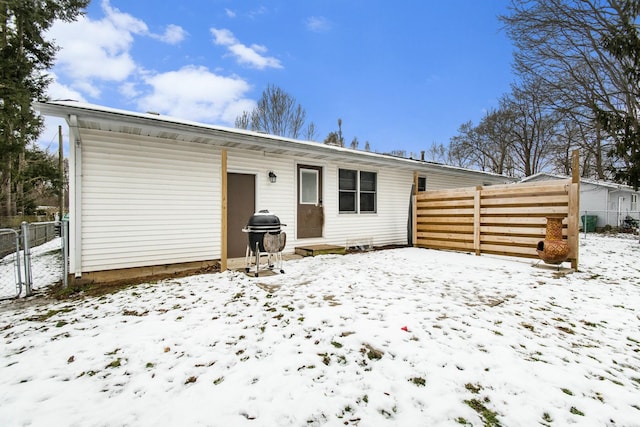 view of snow covered house