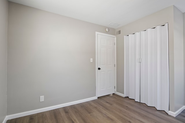 unfurnished bedroom with light wood-type flooring