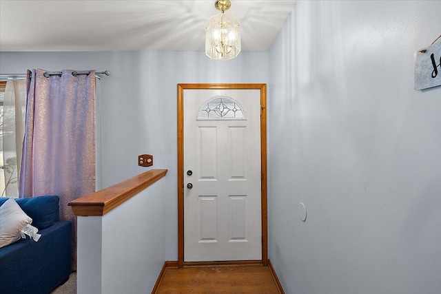 interior space featuring light hardwood / wood-style floors and an inviting chandelier