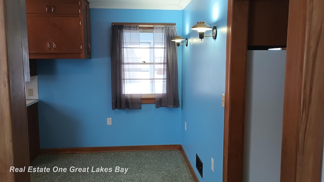 interior space with crown molding