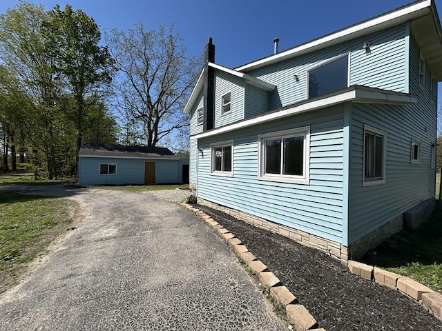 950 Herl Rd, Bronson, MI 49028 - view of side of property featuring a chimney