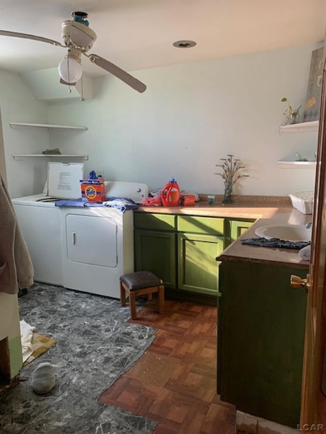 clothes washing area with ceiling fan, separate washer and dryer, dark parquet floors, cabinets, and sink