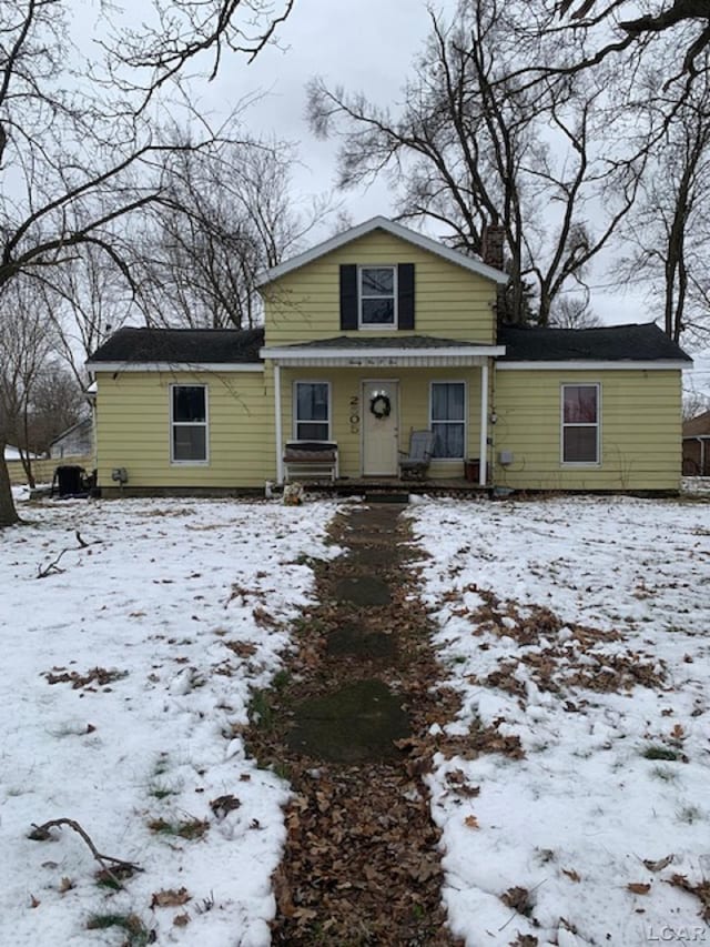 view of property featuring covered porch