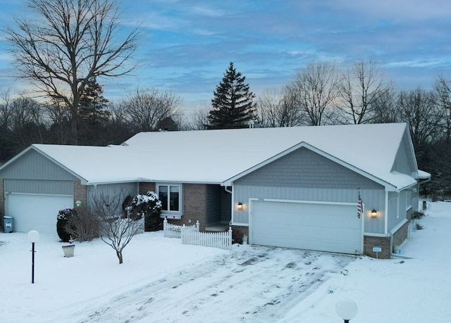 ranch-style house featuring a garage