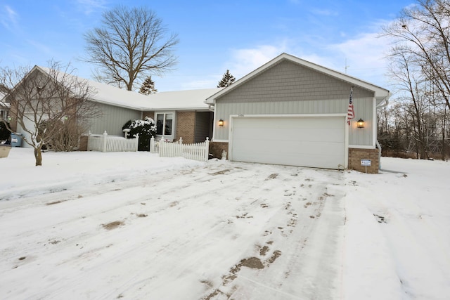 single story home with a garage