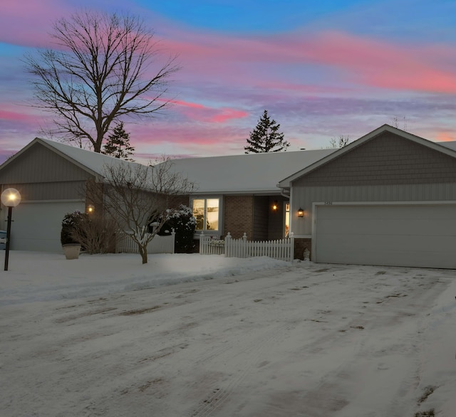 single story home featuring a garage