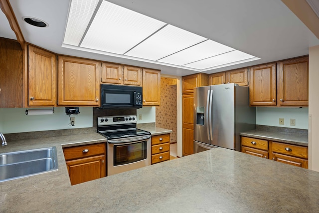 kitchen with appliances with stainless steel finishes and sink