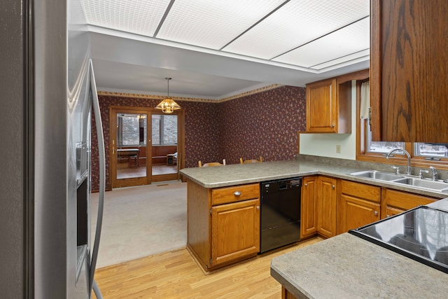 kitchen with sink, stainless steel fridge, dishwasher, hanging light fixtures, and kitchen peninsula