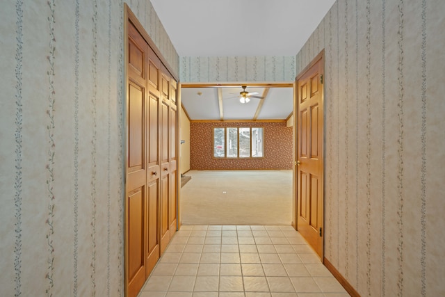 hallway with light colored carpet