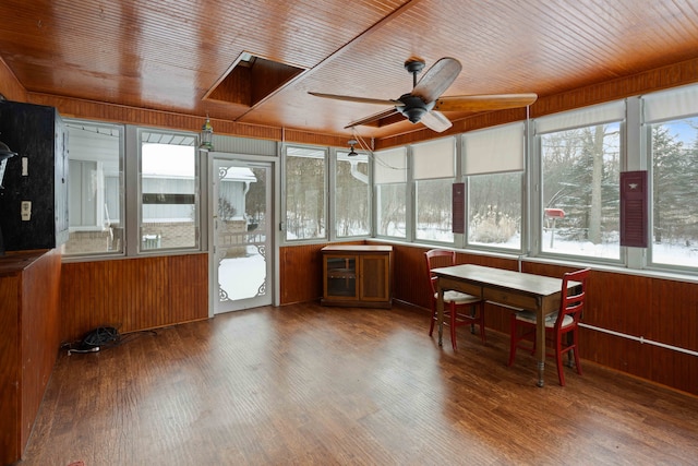 sunroom featuring ceiling fan, plenty of natural light, and wood ceiling