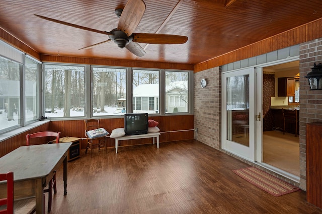 sunroom with wooden ceiling and ceiling fan