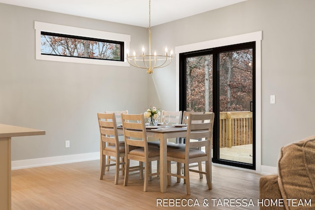 dining room with an inviting chandelier and light hardwood / wood-style floors