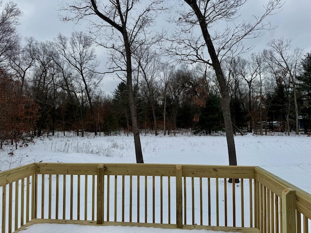 view of snow covered deck