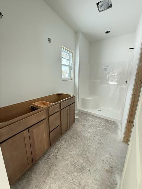 bathroom featuring a shower