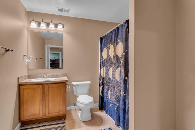 bathroom featuring toilet, walk in shower, tile patterned floors, and vanity